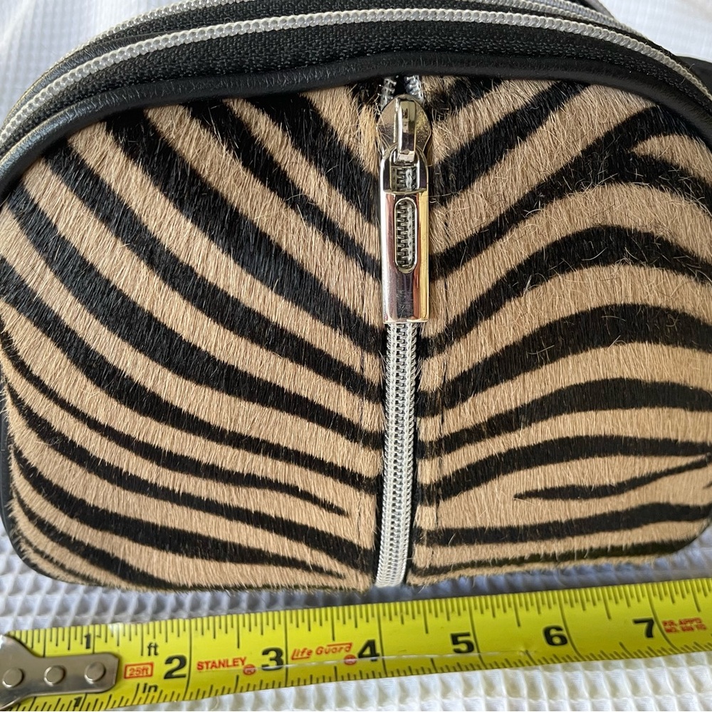 Italian leather and animal hair shoulder bag.